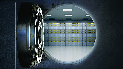 Secure corporate data reliably with Securepoint Unified Backup View through an open safe door onto lockers