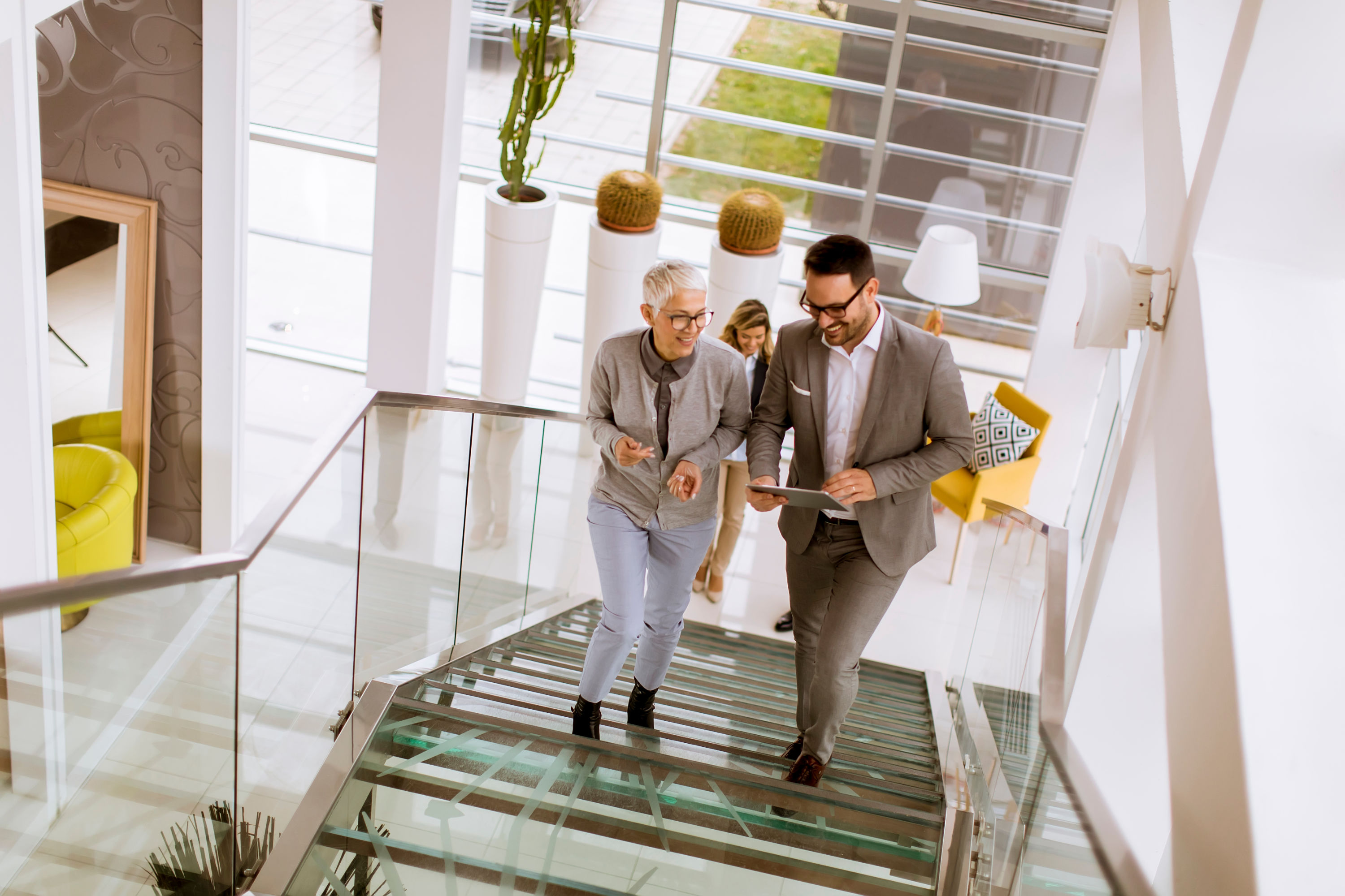 Man walks up the stairs with a customer