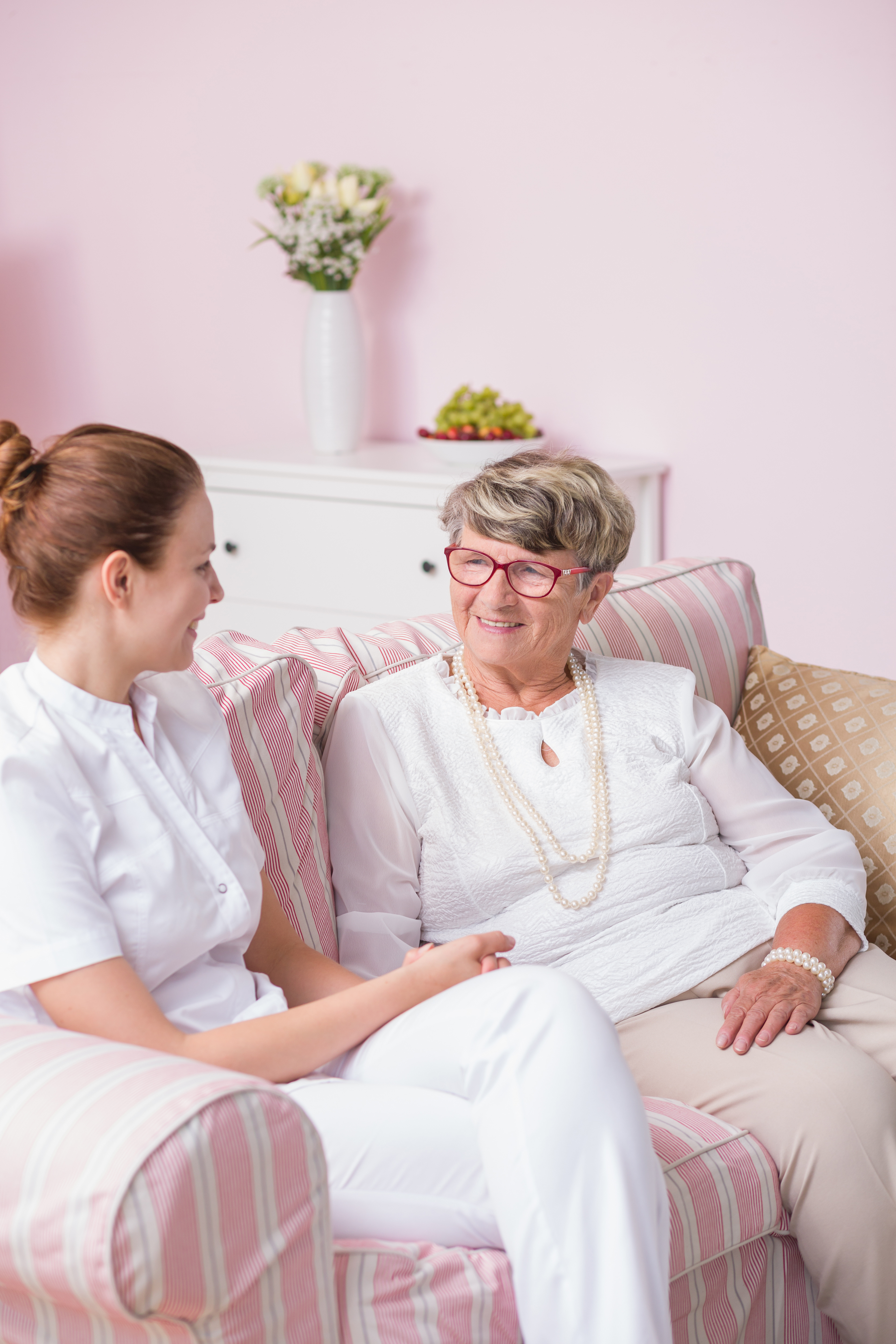 Nurse converses with senior citizen