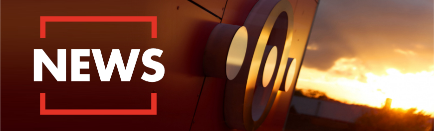 Securepoint Gebäude bei Nacht mit News Schriftzug 